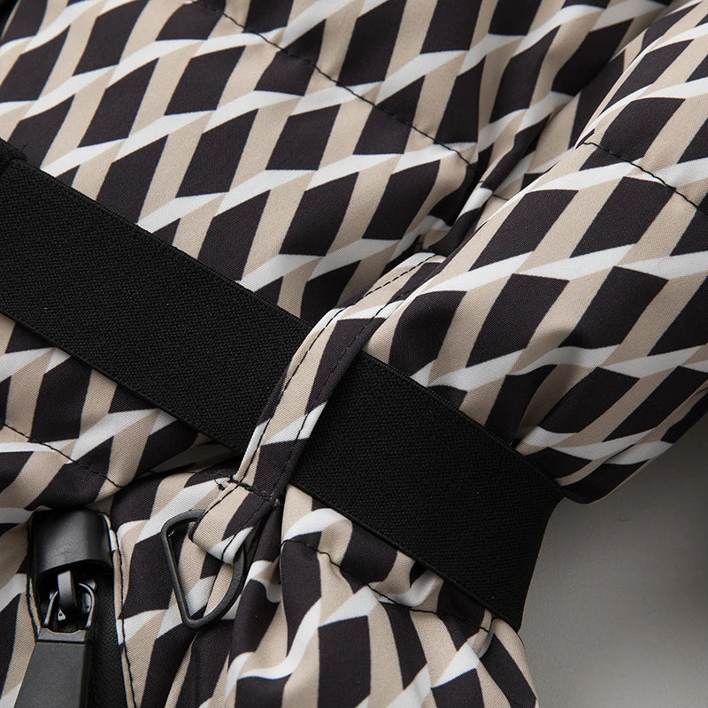 Close-up of geometric-print parka's belt loop and waist strap