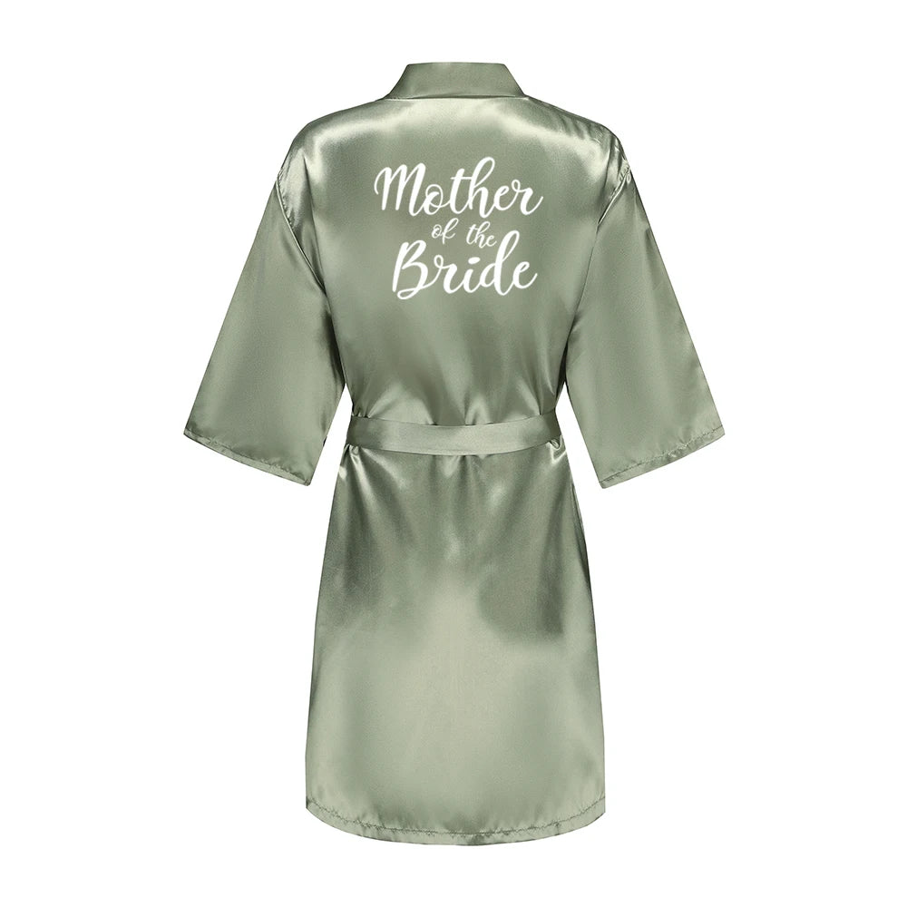 Sage green satin robe with white Mother of the Bride lettering on the back