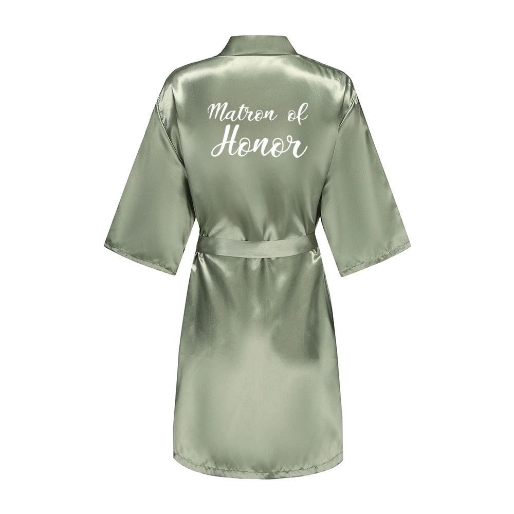 Sage green satin robe with white “Matron of Honor” back lettering and tie belt
