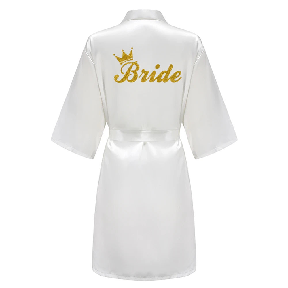 White satin robe with glittery gold “Bride” and crown on the back