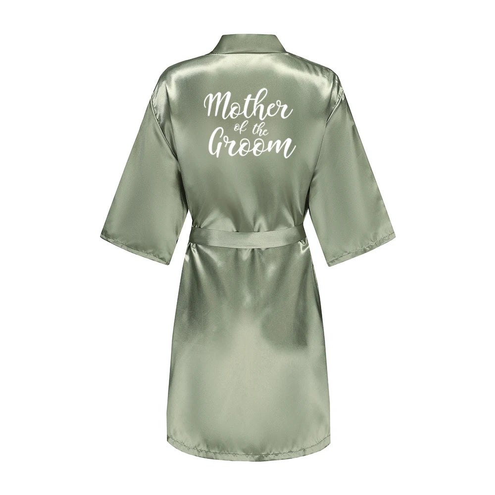 Sage green satin robe with white Mother of the Groom lettering on the back