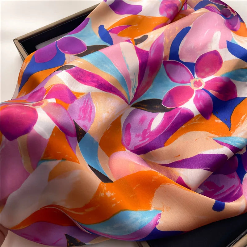 Close-up of silky scarf fabric with bright abstract floral print