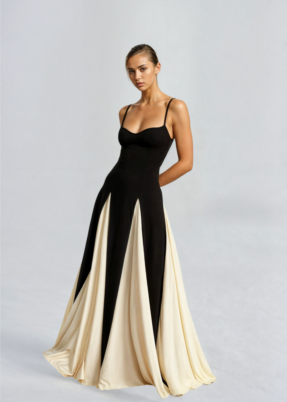 Black satin evening maxi dress with spaghetti straps and vertical cream colorblock skirt panels