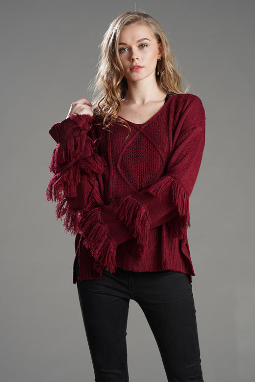 Red tassel knit sweater with V-neck and fringed sleeve cuffs