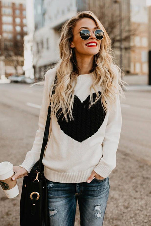 White knit sweater with black heart pattern, crew neck, long sleeves