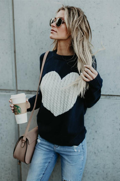 Navy knit sweater with white heart cable-knit front, crew neck