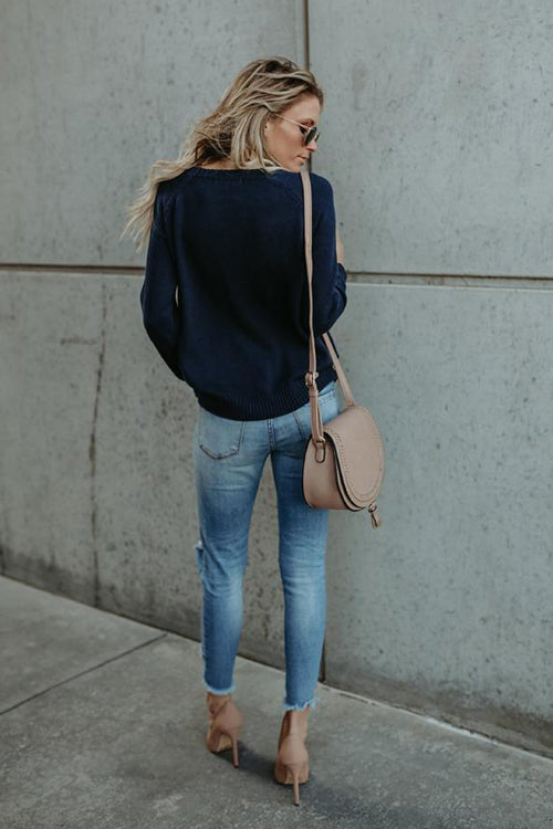 Navy knit sweater with long sleeves and crew neck, back view