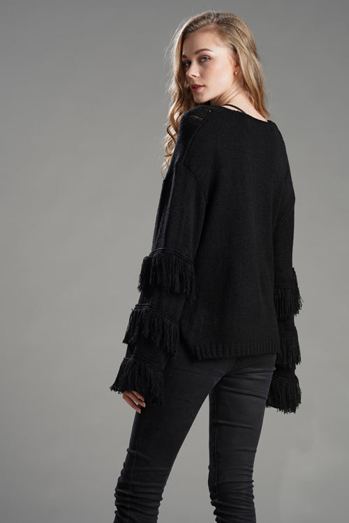 Black tassel knit sweater with fringe detail on wide sleeves