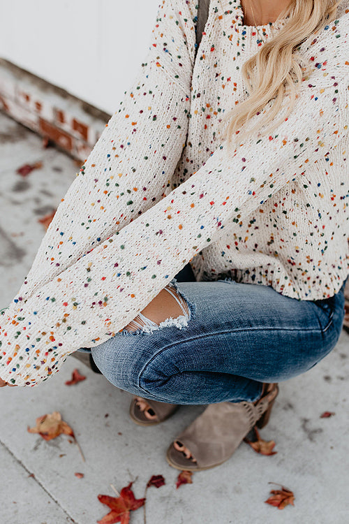 Beige knit sweater with colorful dot speckles and loose long sleeves