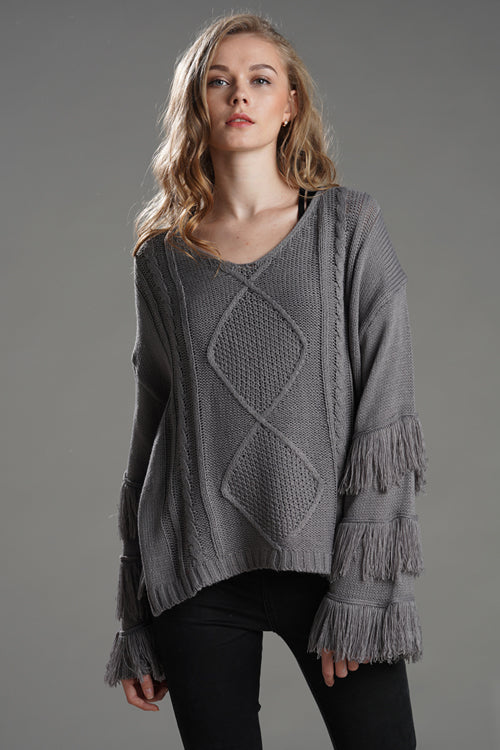 Grey tassel knit sweater with diamond pattern and fringe sleeve layers