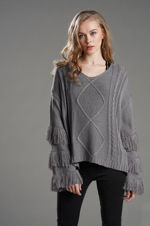 Grey tassel knit sweater with diamond textured front and fringe cuff sleeves