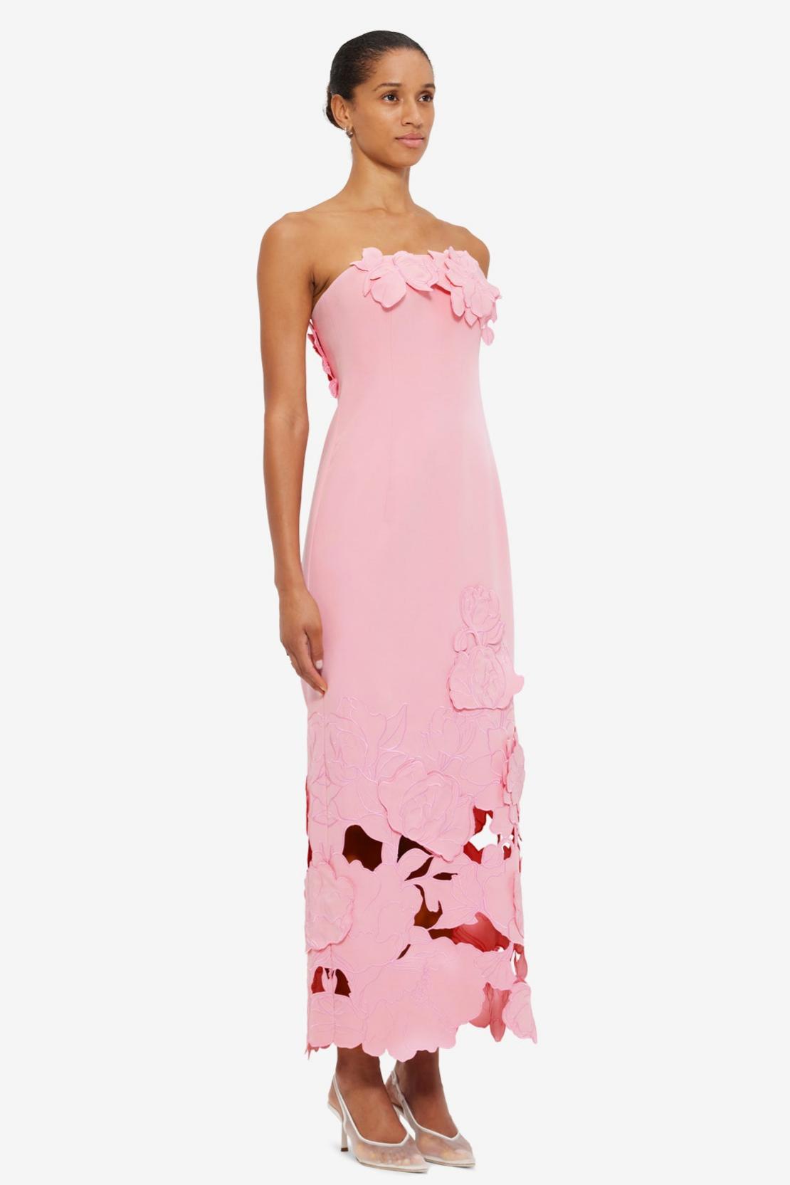 Pink strapless satin maxi dress with 3D floral appliqué and cutout hem