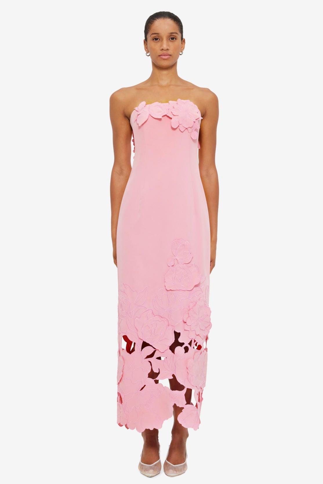 Pink strapless satin maxi dress with 3D floral appliqué and cutout hem