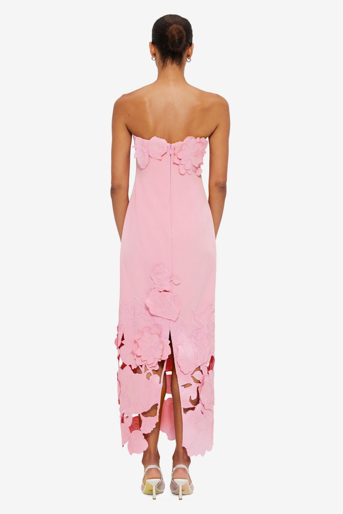 Strapless pink satin maxi dress with 3D floral appliqués and cutout hem