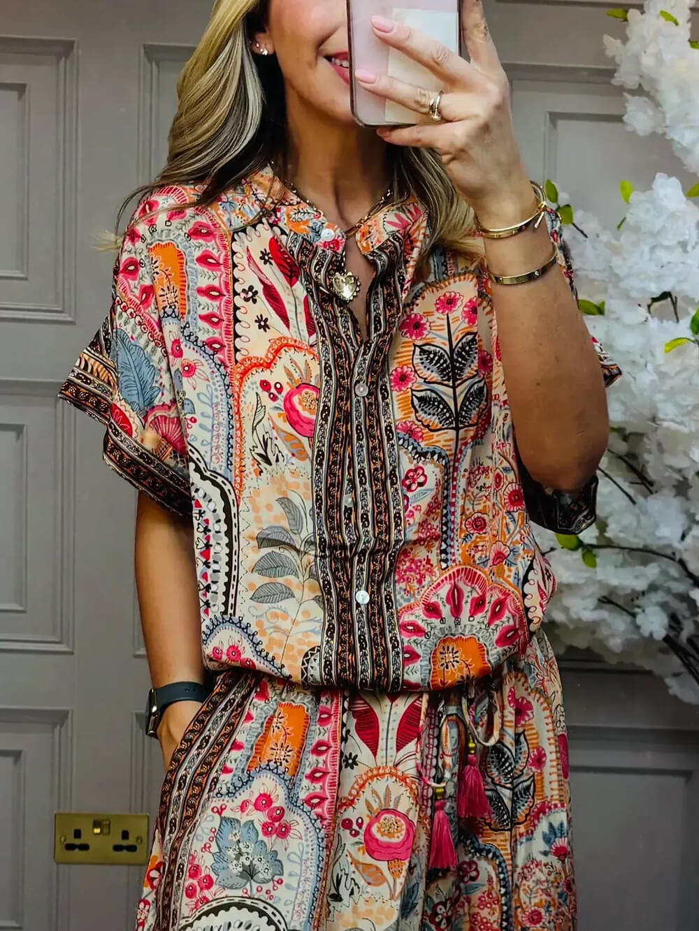 Red short-sleeve boho paisley blouse with button-front and V-neck collar