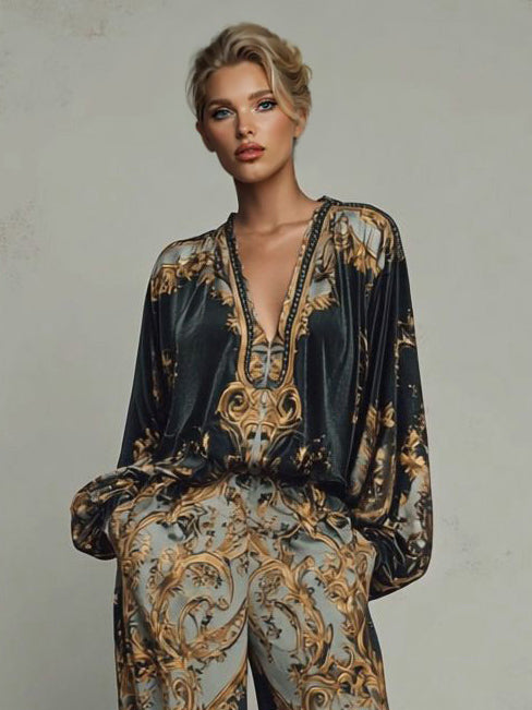 Black satin V-neck blouse and wide-leg trouser set with ornate gold-and-cream baroque print