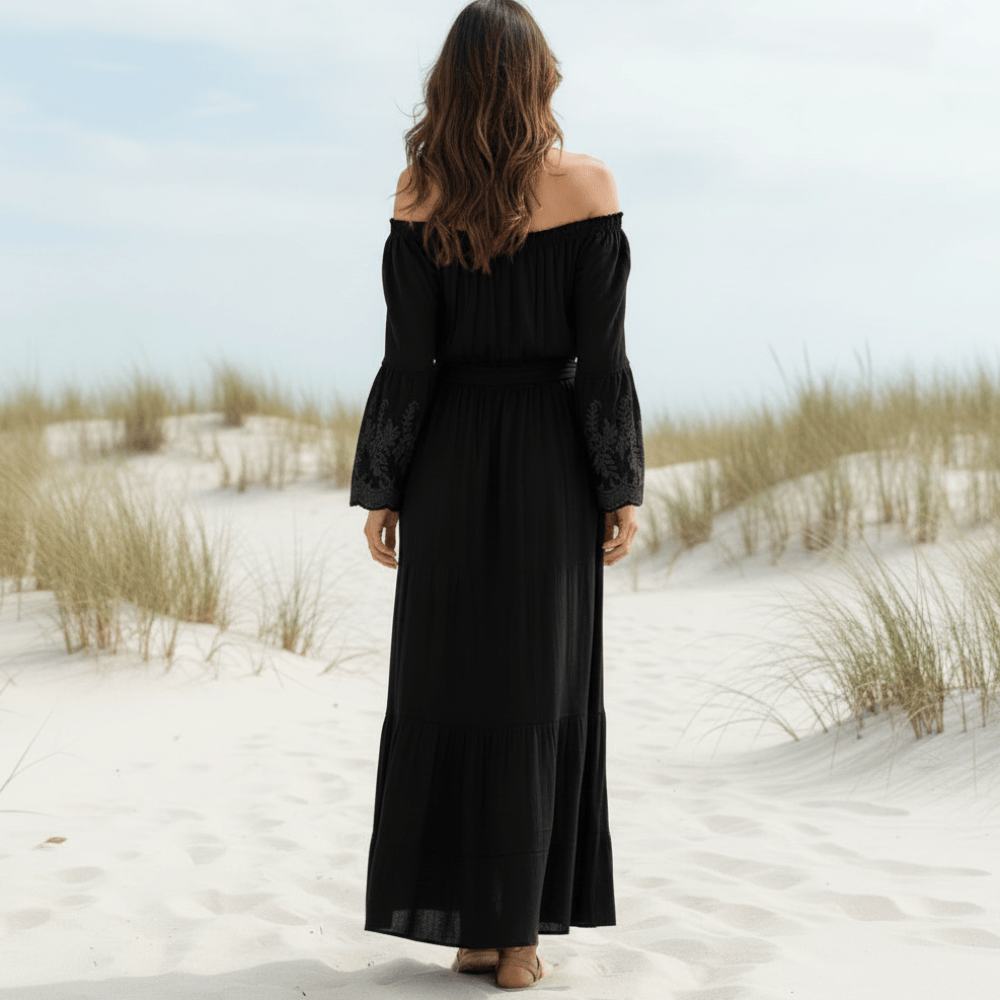 Black off-shoulder maxi dress with smocked waist, lace-trim sleeves, tiered back length