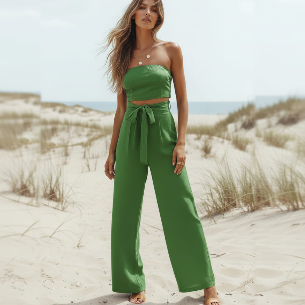 Green strapless linen jumpsuit with tied waist bow, wide-leg pant legs