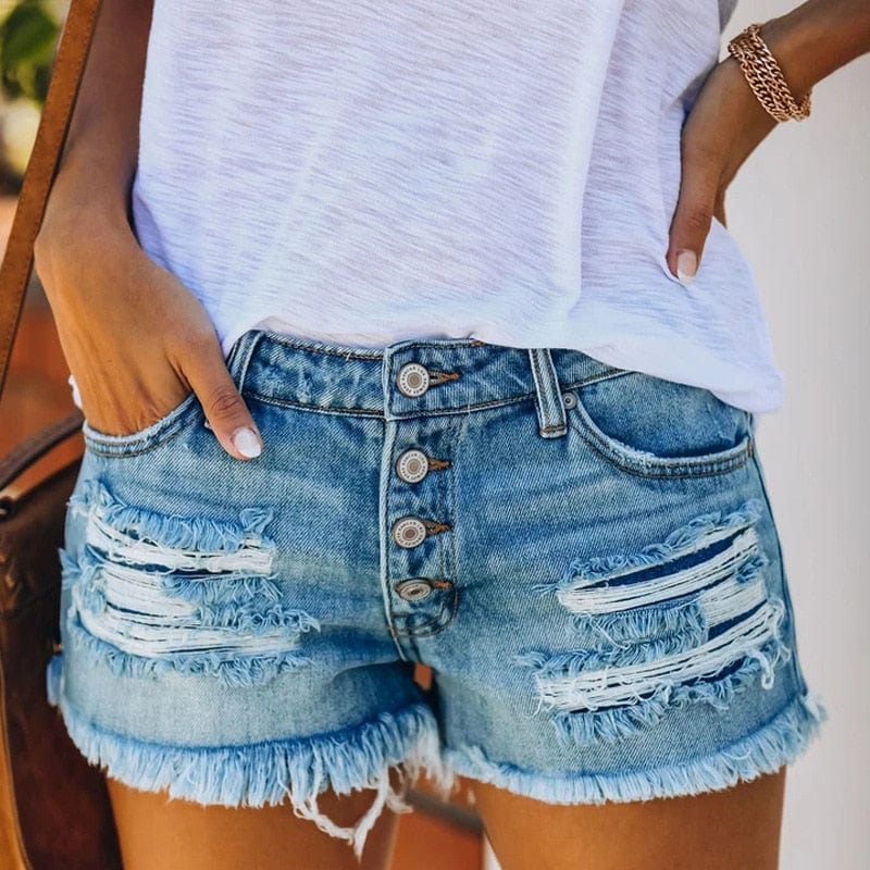 Light blue denim button-fly shorts with layered rips and frayed hem.