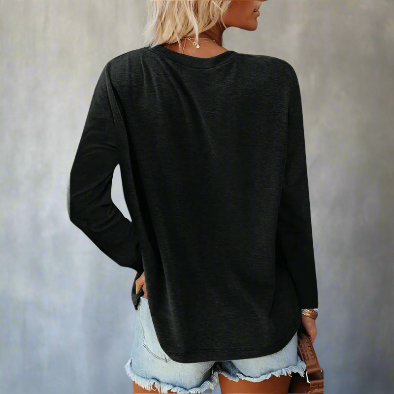 Women’s relaxed long-sleeve crew neck top in black, shown from the back.