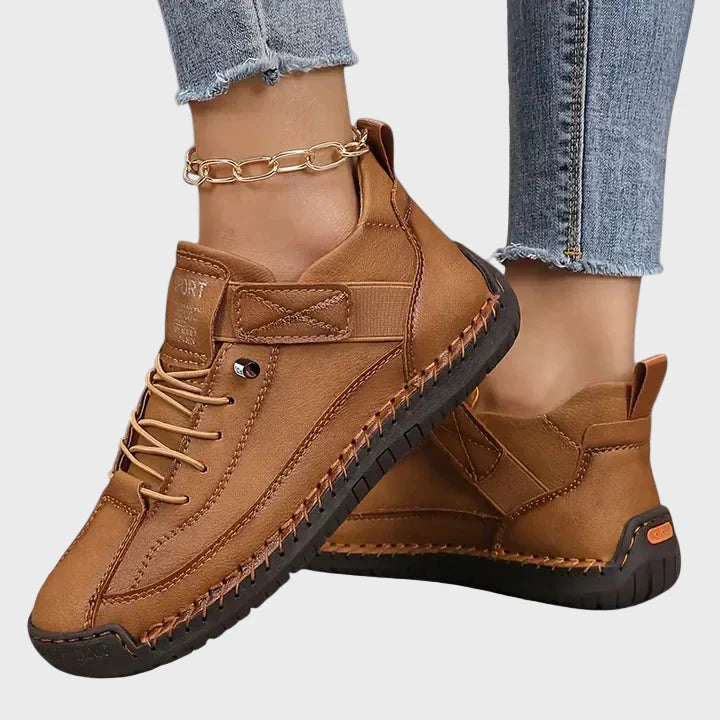 Tan brown faux leather lace-up sneakers with ankle strap and dark rubber sole