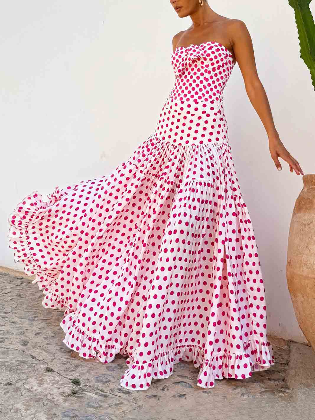 Pink heart-print strapless tiered ruffle maxi dress with gathered bodice.