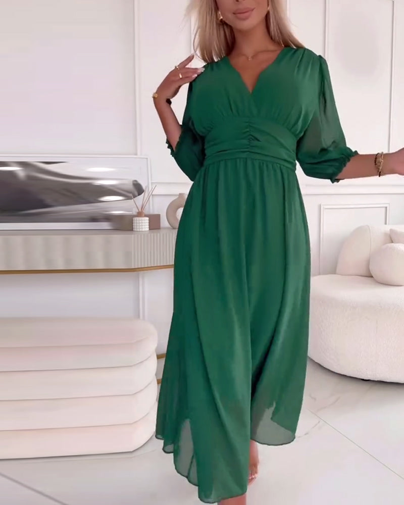 Green chiffon midi dress with V-neckline and ruched waist seam, puff sleeves