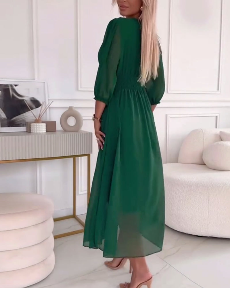 Green chiffon midi dress from back view with V-neck and ruched waist
