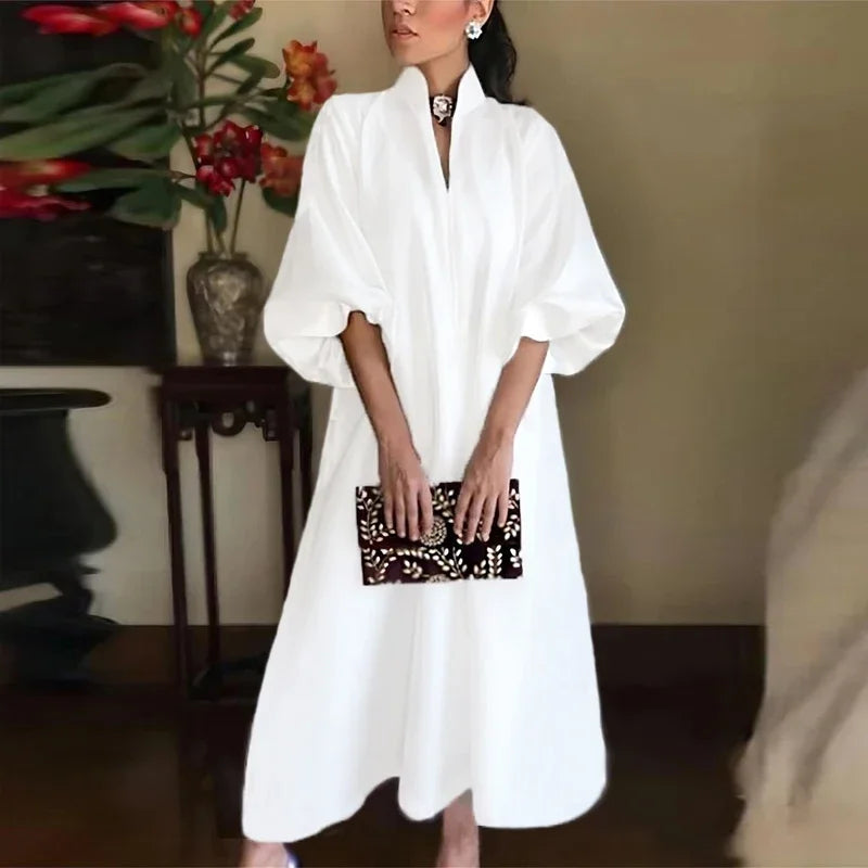 White high-neck maxi dress with loose sleeves and keyhole neckline