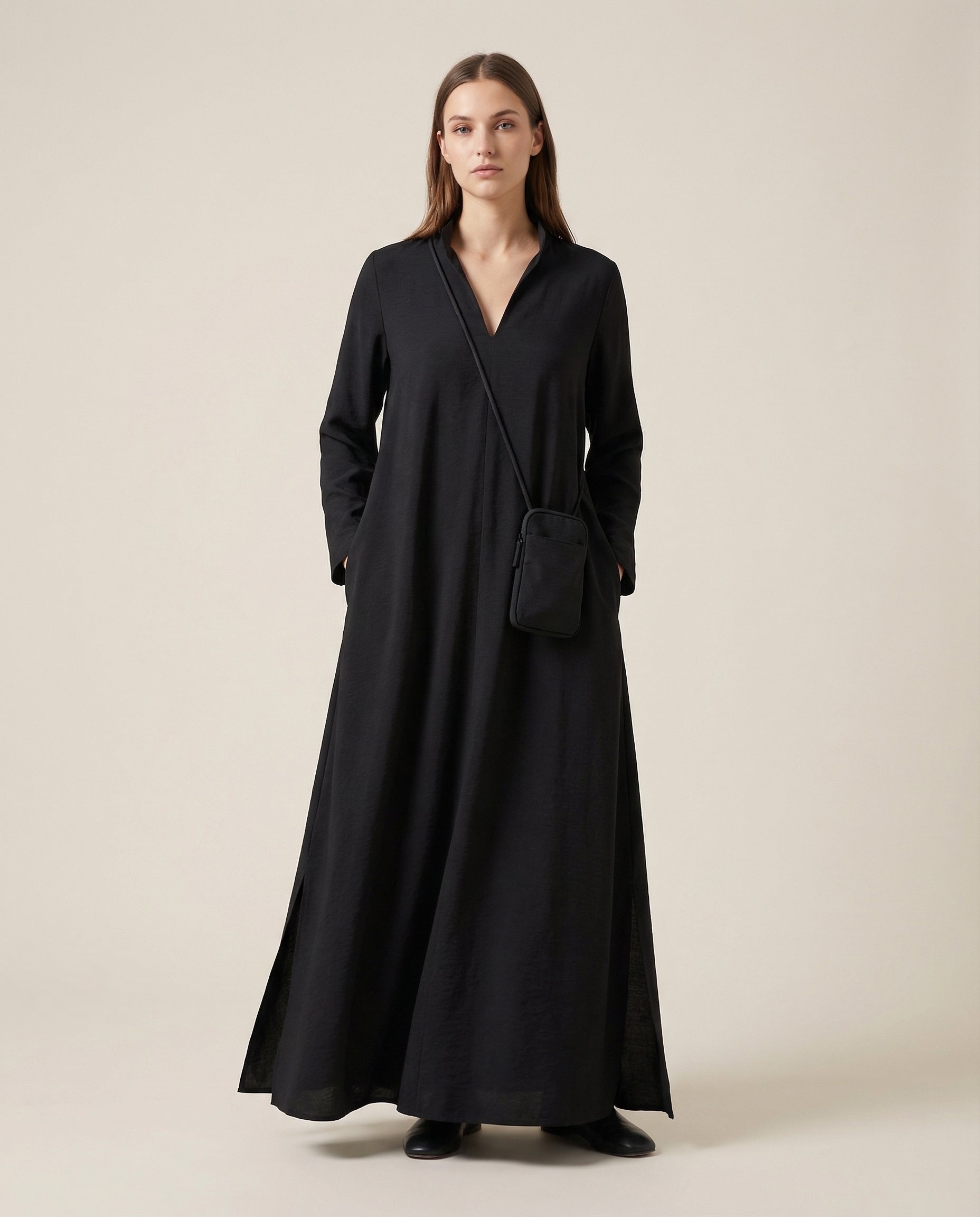 Black long-sleeve linen maxi dress with stand collar and side pockets, loose fit