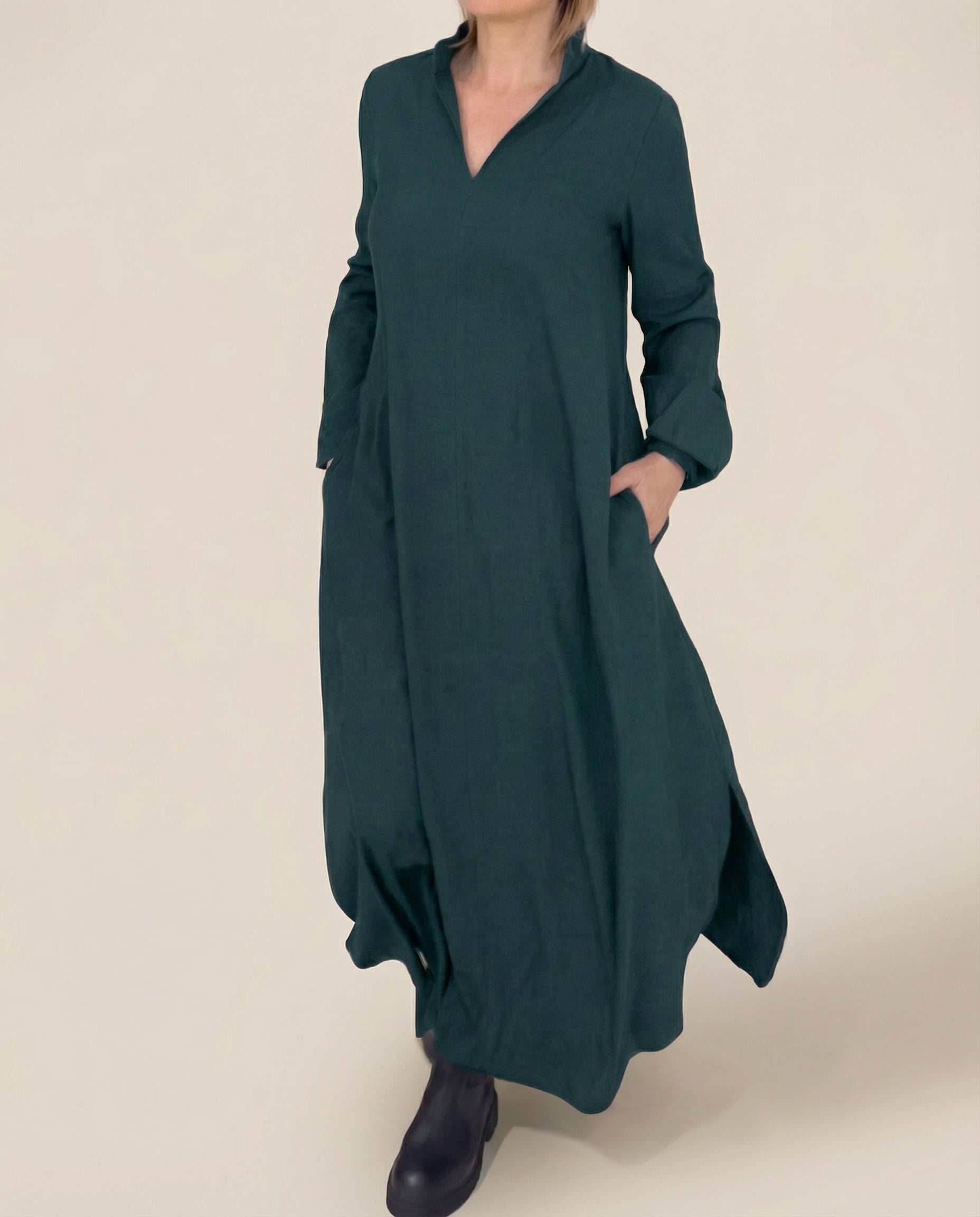 Green long-sleeve linen maxi dress with stand collar and side pockets, loose fit