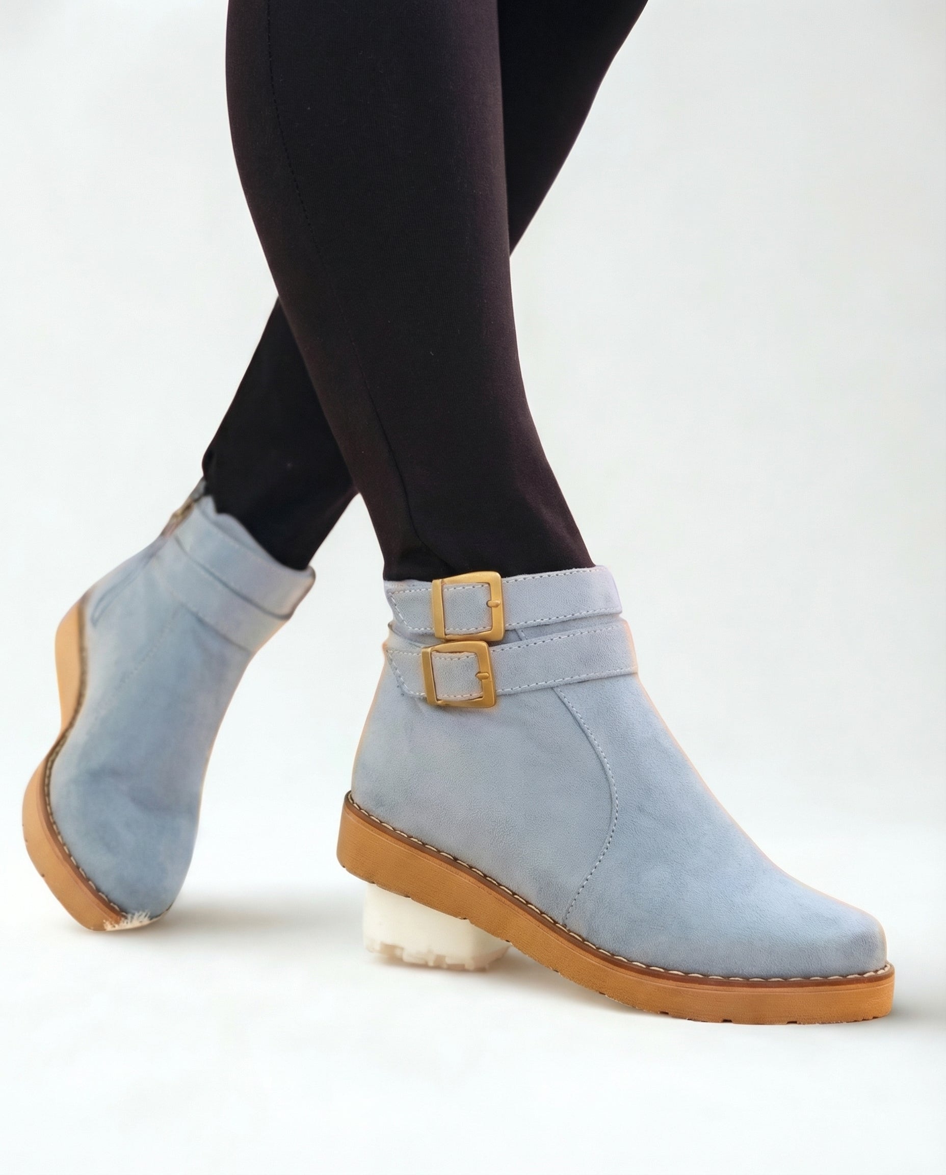 Light blue suede ankle boots with double buckle strap, flat sole