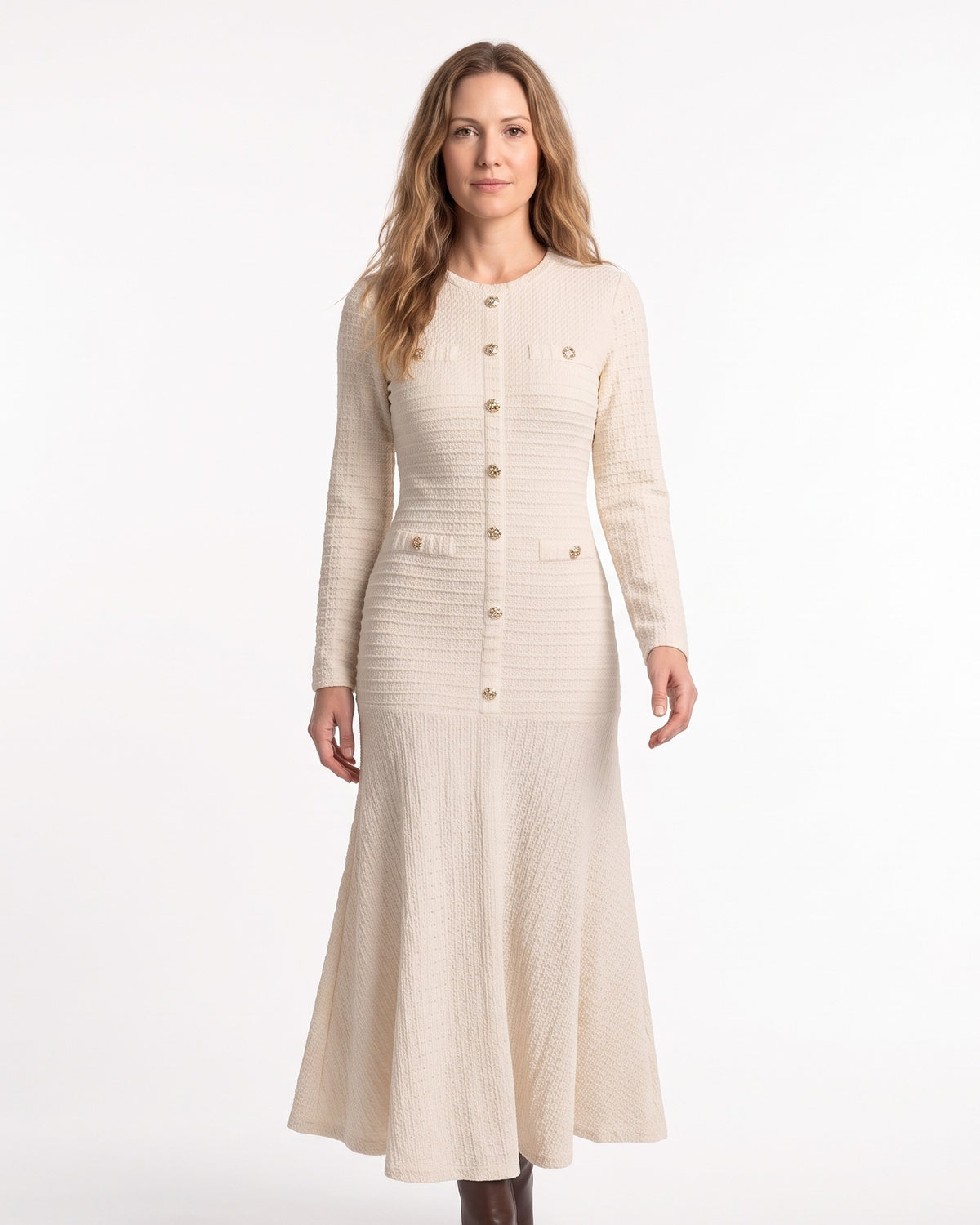 Cream knit maxi sweater dress with long sleeves, button-front, flap pockets, mermaid hem
