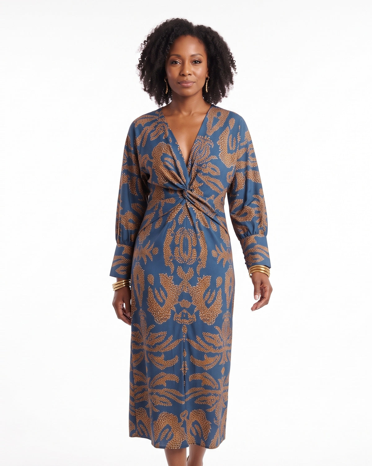 Blue midi dress with knot front waist, draped blouson sleeves, bold leaf motif