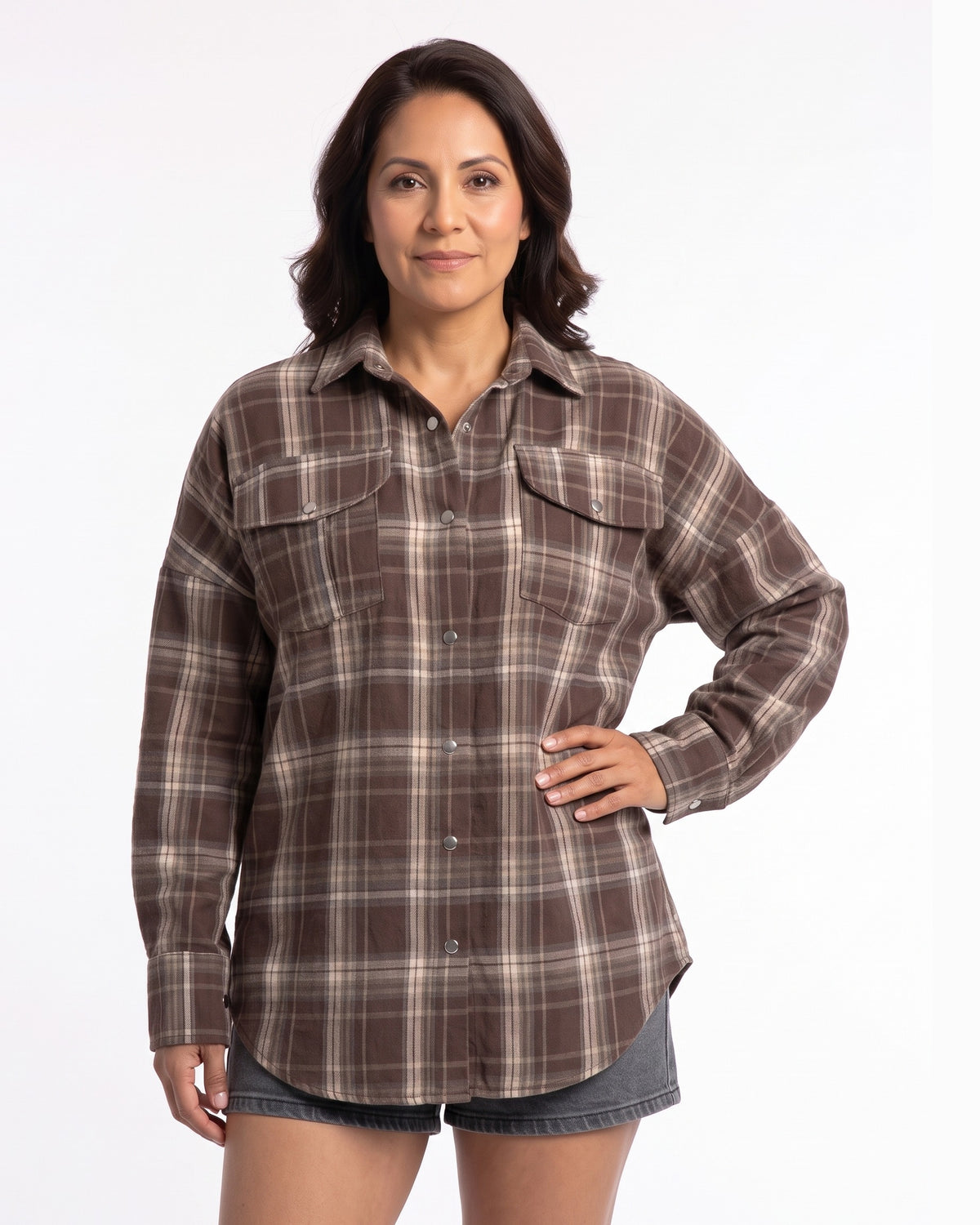Brown plaid flannel button-up shirt with pointed collar, chest pockets, long sleeves, relaxed hem