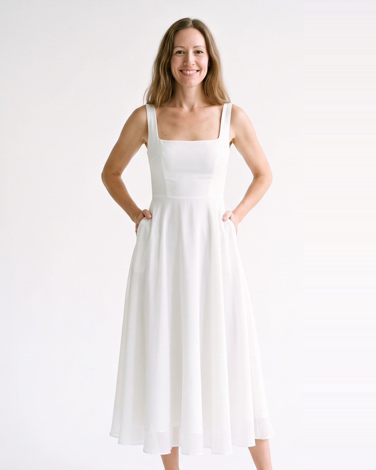 White square-neck sleeveless chiffon dress with tea-length flared skirt