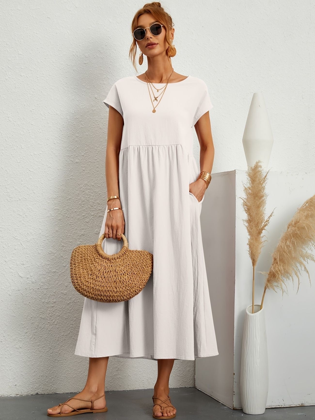 White midi maxi dress with gathered smocked bodice, short sleeves, A-line silhouette