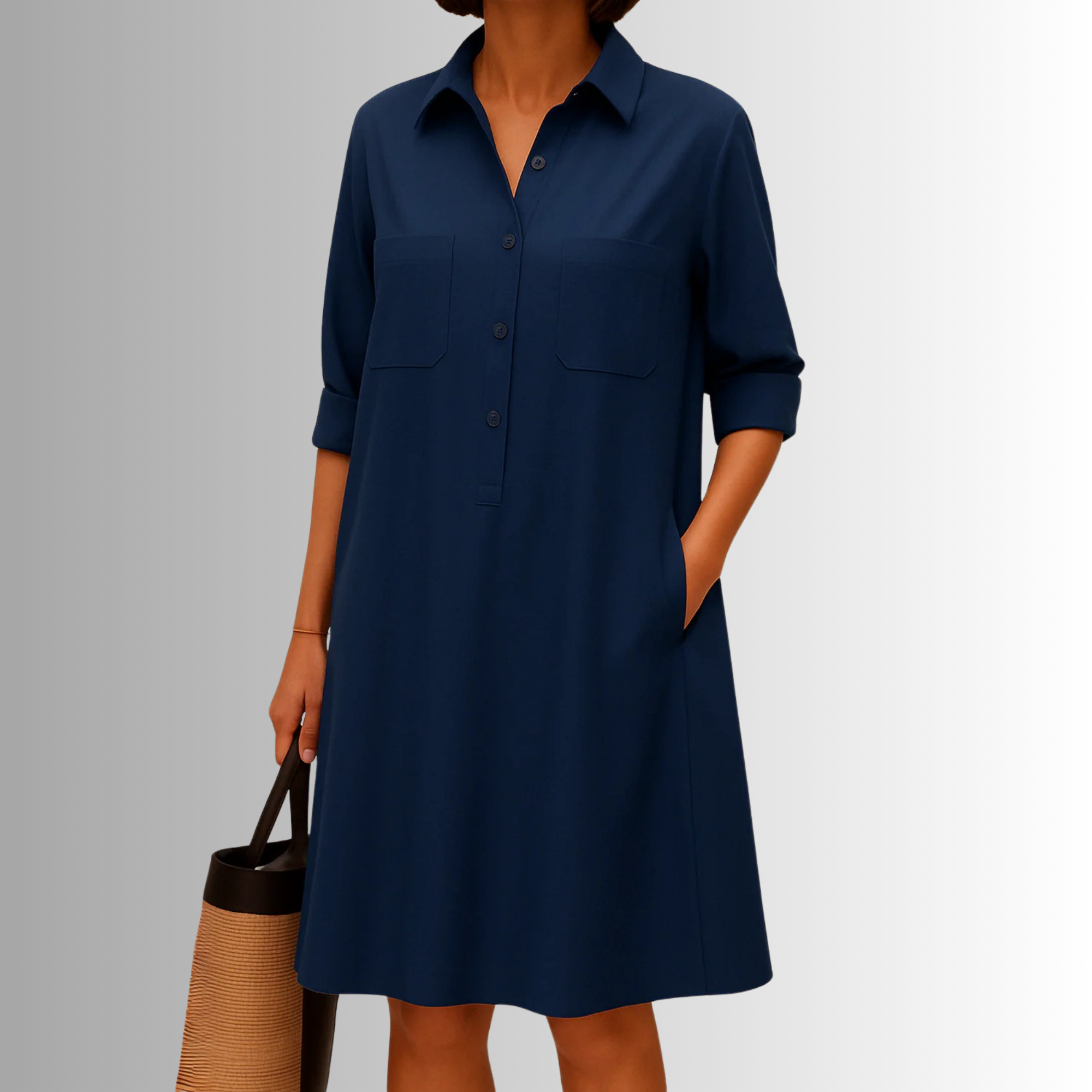 Dark blue button-down A-line dress with collar, front buttons, and chest pockets.