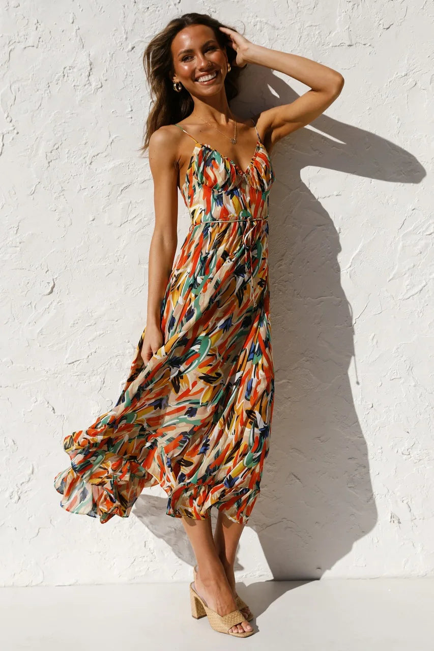 Floral spaghetti strap midi dress in orange multi-color print, fitted bodice, tiered skirt