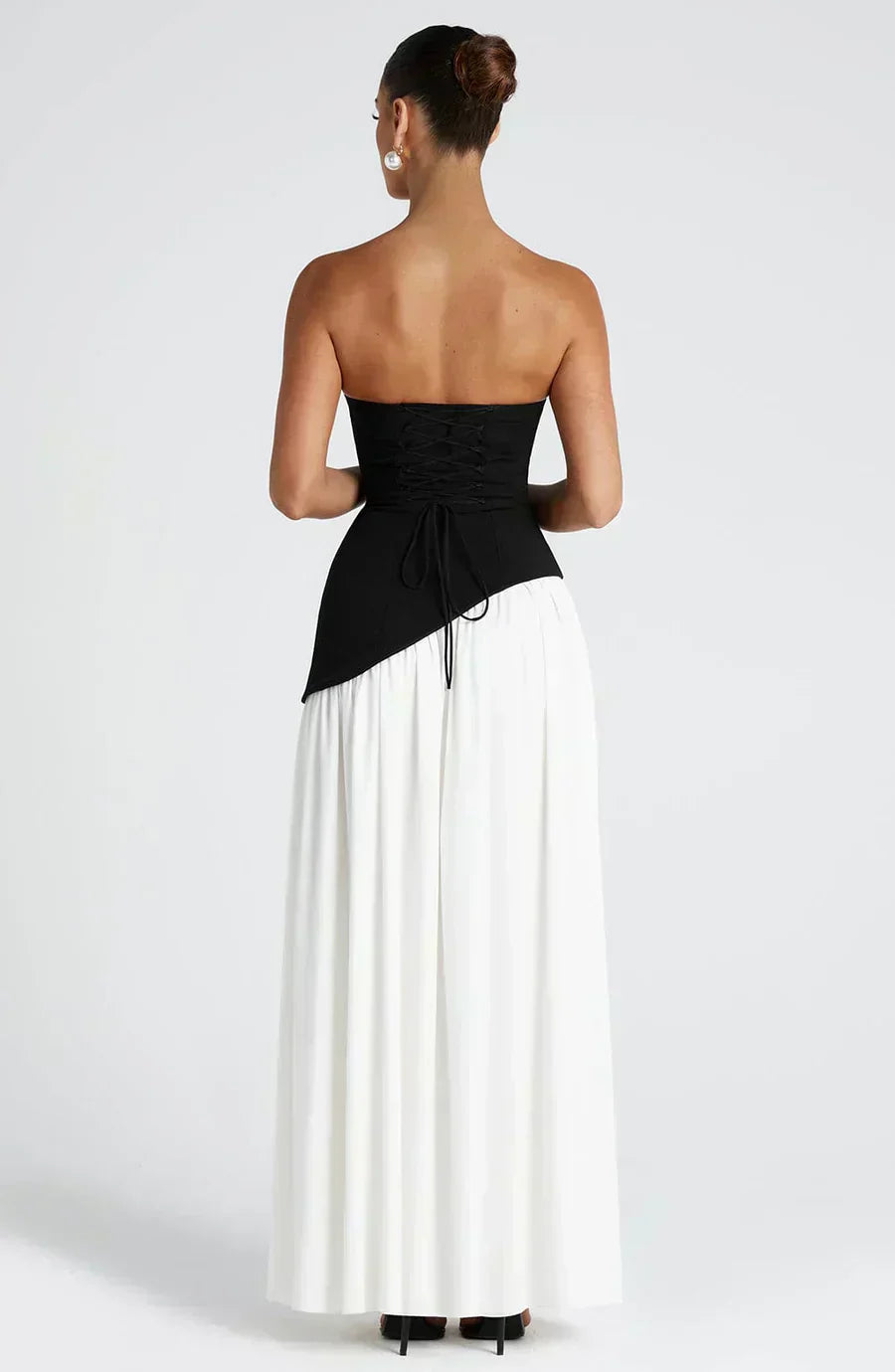 Black bodice and white skirt maxi dress with draped tie at waist and side slit