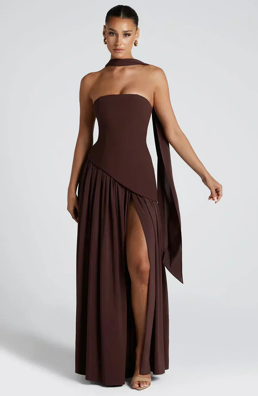 Dark brown strapless asymmetric maxi dress with flowing overlay and high leg slit