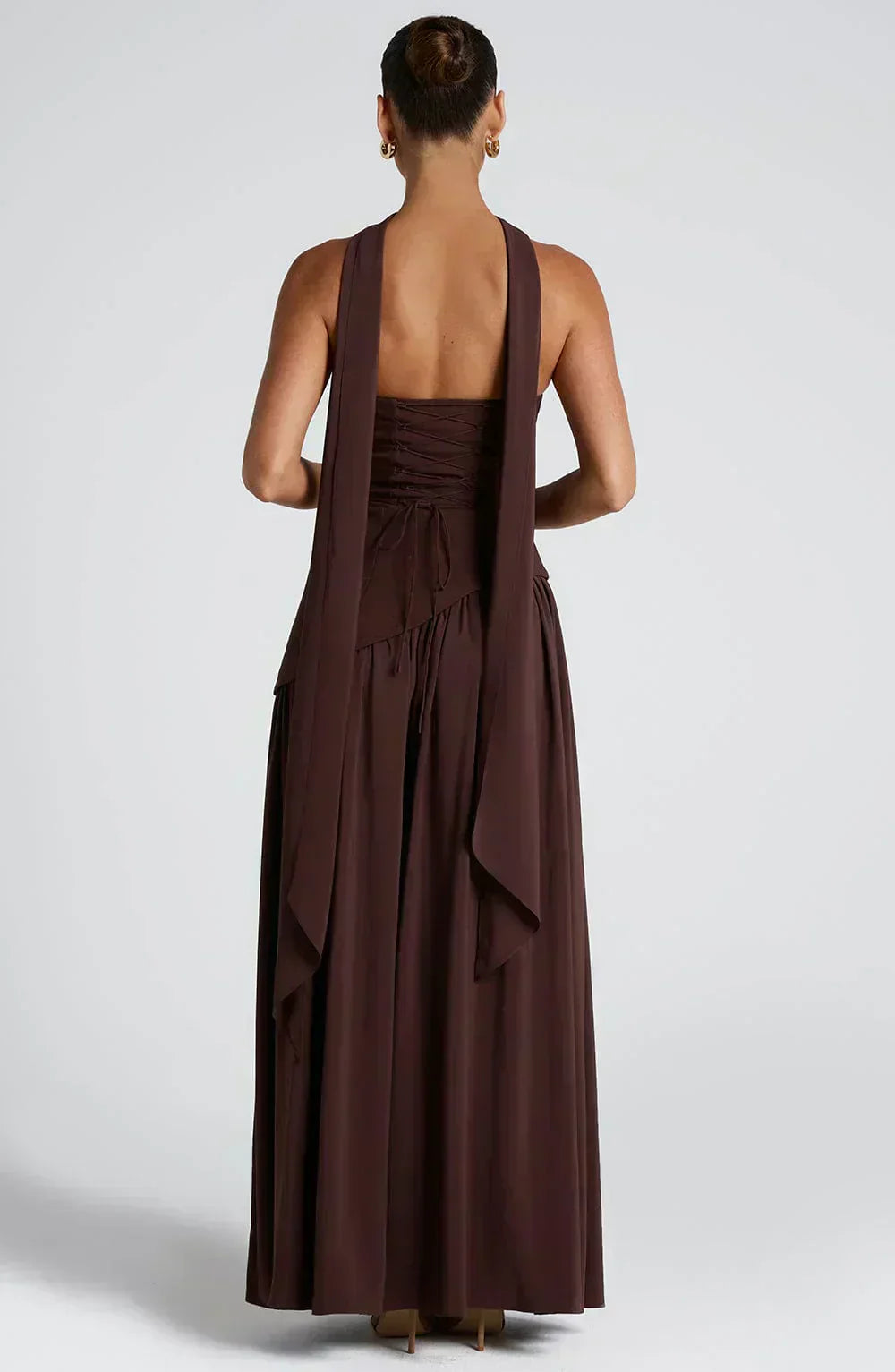 Asymmetric maxi wedding guest dress in dark brown, open back with thin straps