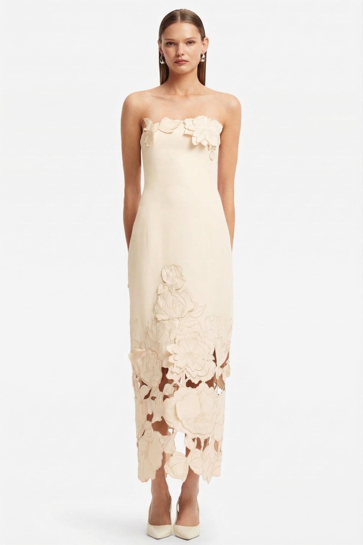 Strapless beige satin bodycon maxi dress with 3D floral appliqué and cutout hem