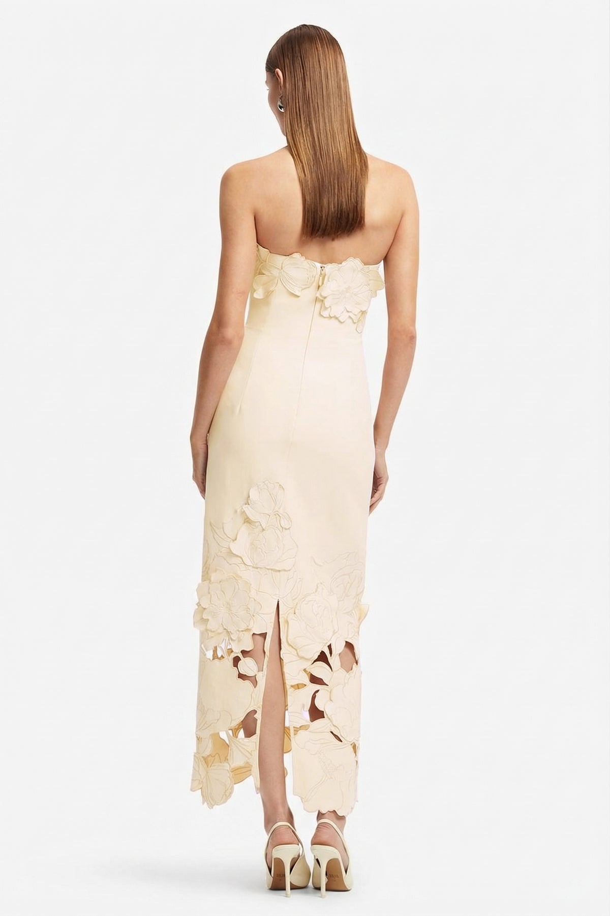 Strapless beige satin bodycon maxi dress with 3D floral appliqué and cutout hem