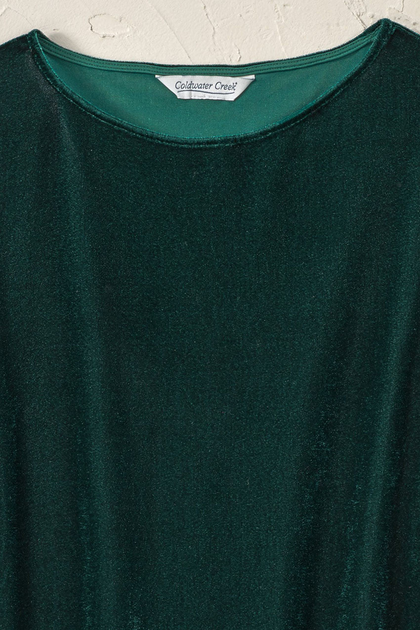 Green velvet tunic top neckline detail with crew neck and three-quarter sleeves.