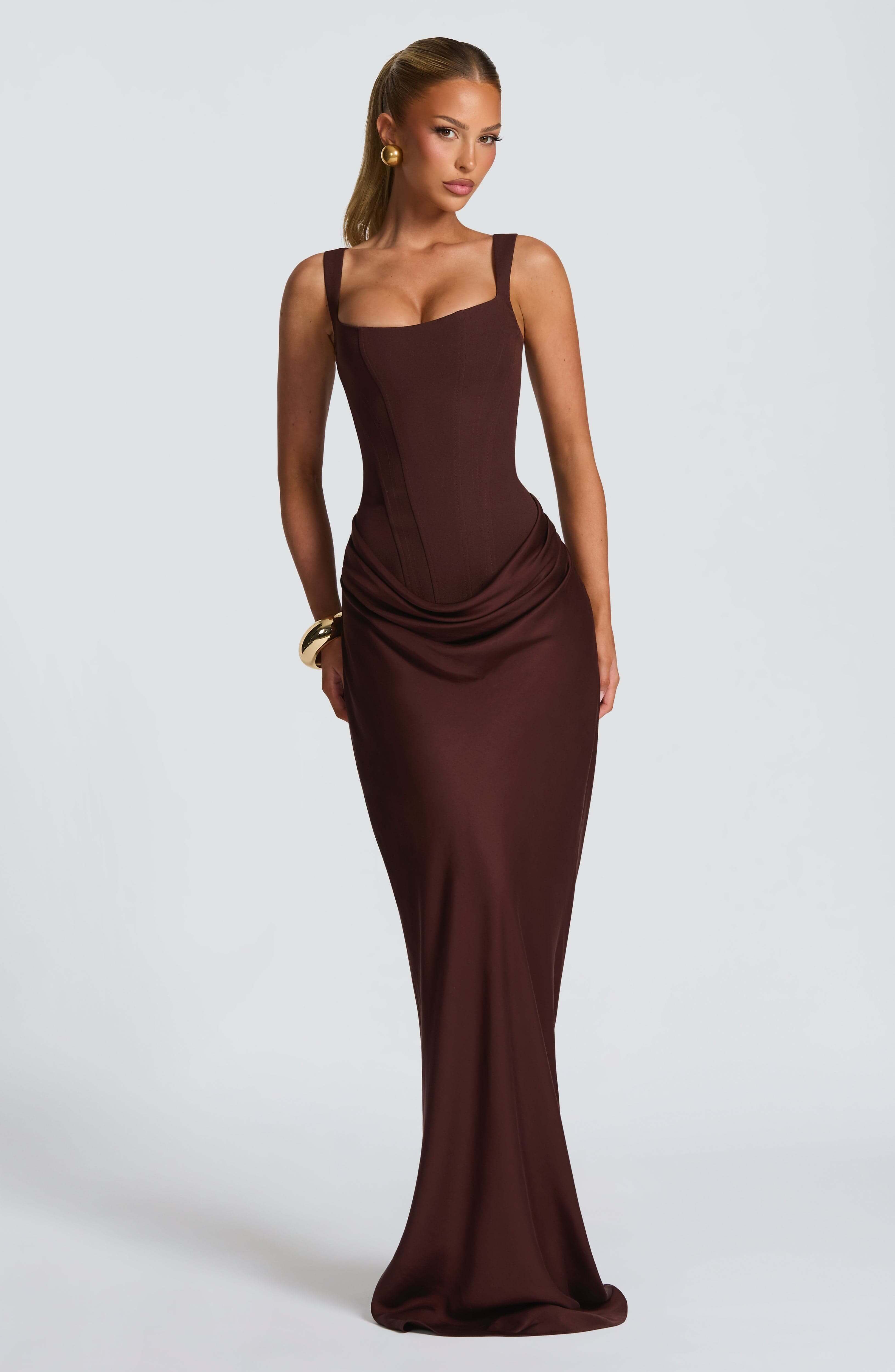 Deep burgundy sleeveless bodycon maxi dress with draped waist and fitted skirt