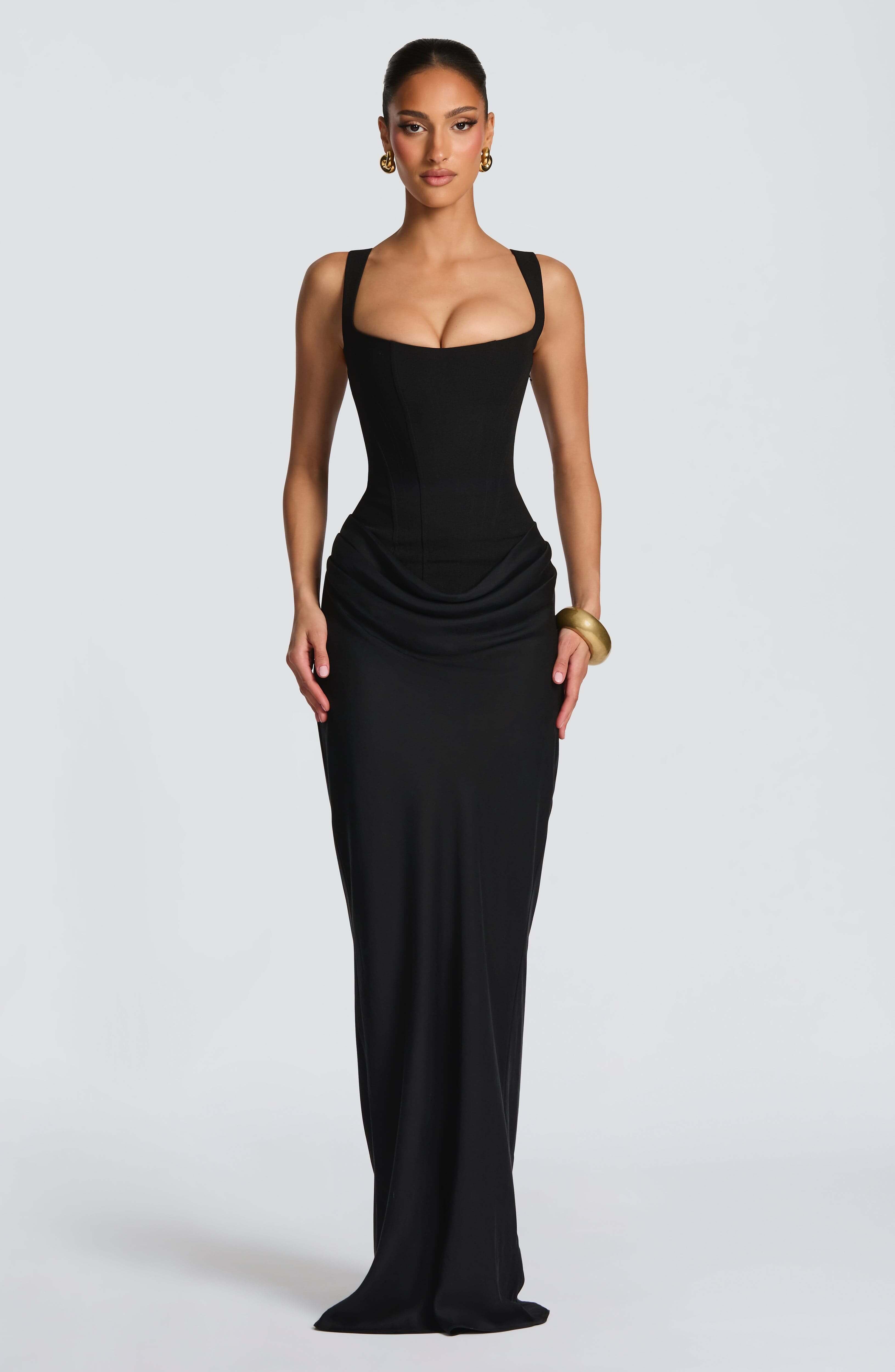 Black sleeveless bodycon maxi dress with square neckline and draped waist