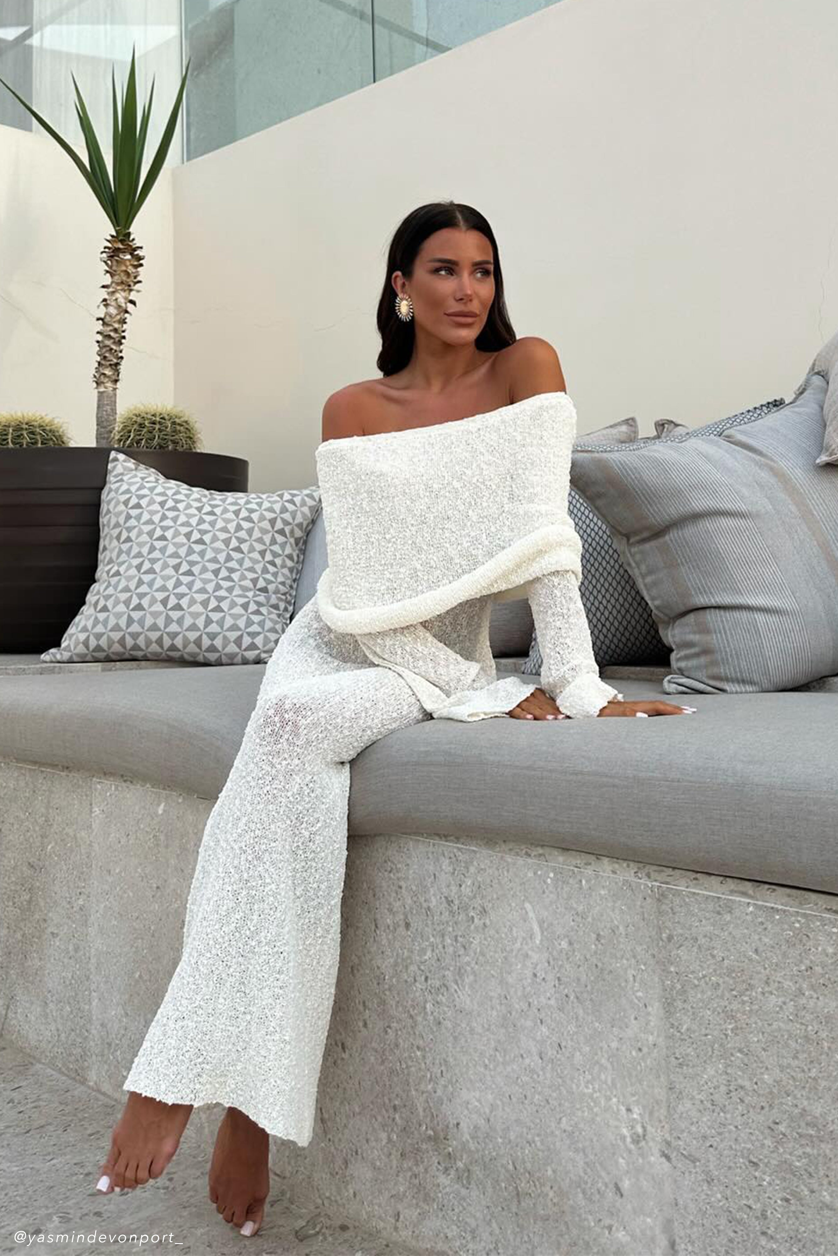 Off-white off-shoulder knit bodycon maxi dress with draped foldover and long sleeves